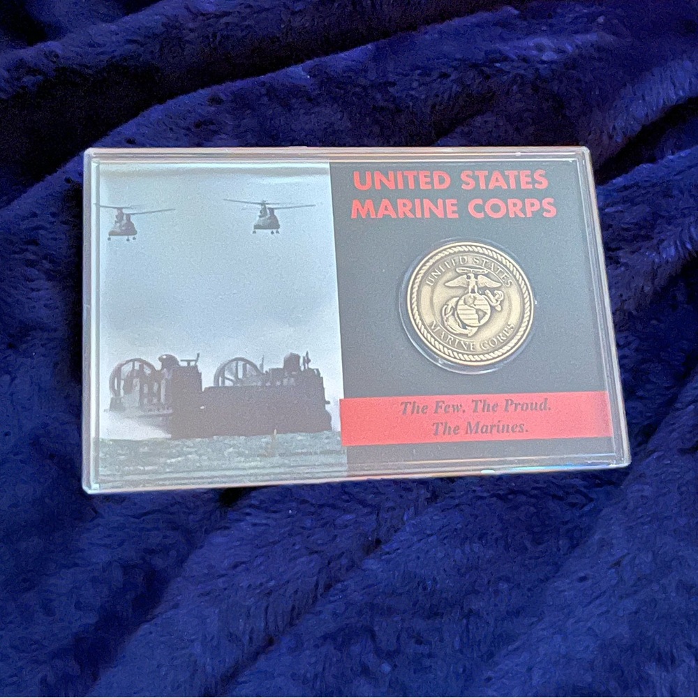 Marine Corps challenge coin in plastic case